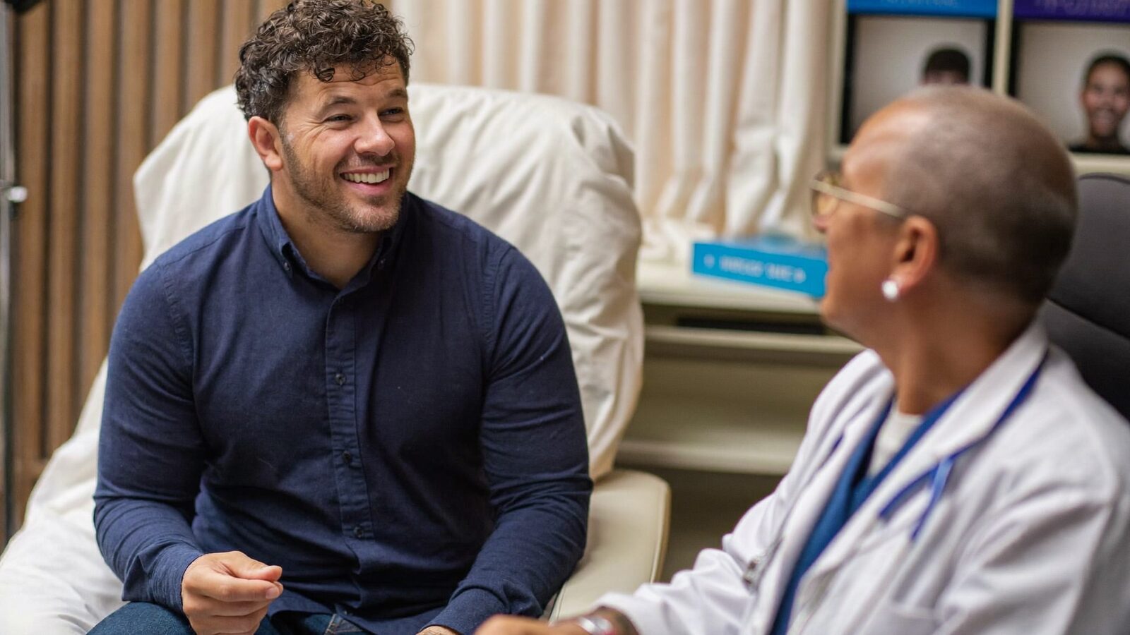 Man talking with a doctor in a white coat during a consultation